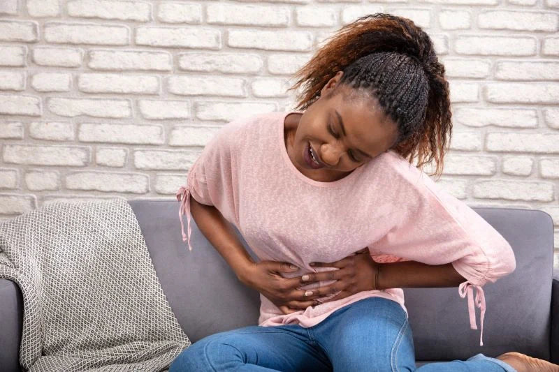 A close-up of Healthy V urinary tract health supplements, focusing on the peach cranberry flavor designed to support urinary and vaginal health.